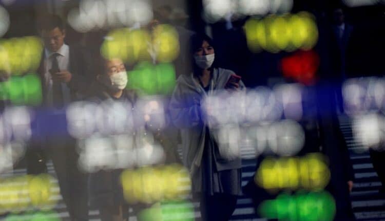 Asian shares hover near record high, risk currencies in favor