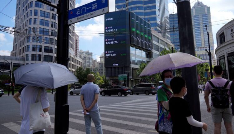 Falling stocks and bruised dollar reel from BOJ's surprise policy shift