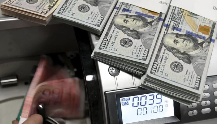 Dollar creeps up in subdued start to new year